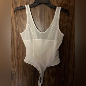 Forever 21 white bodysuit. Size small. New with tags